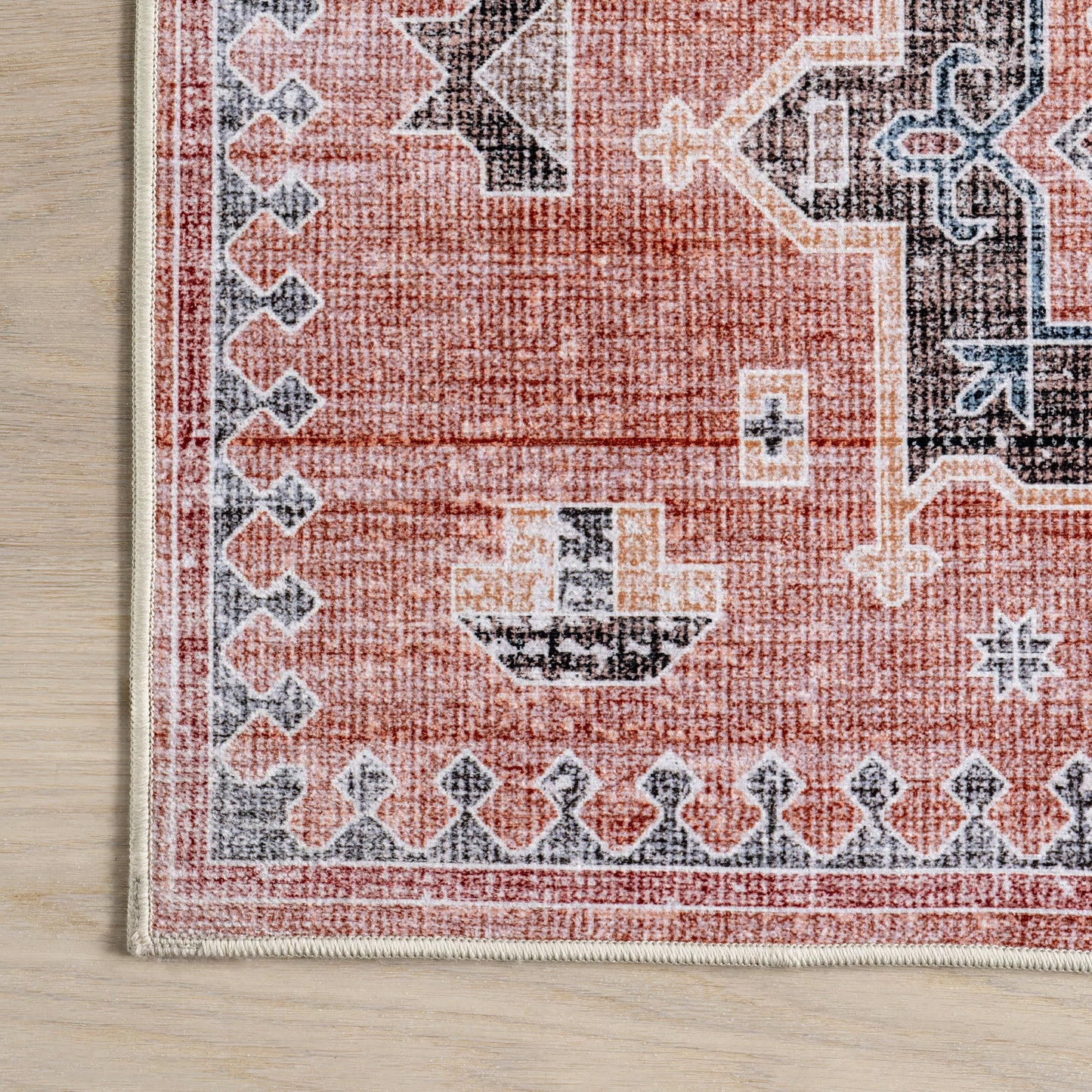 Brenda Hazy Heraldry Spill-Resistant Washable Rug in Pink