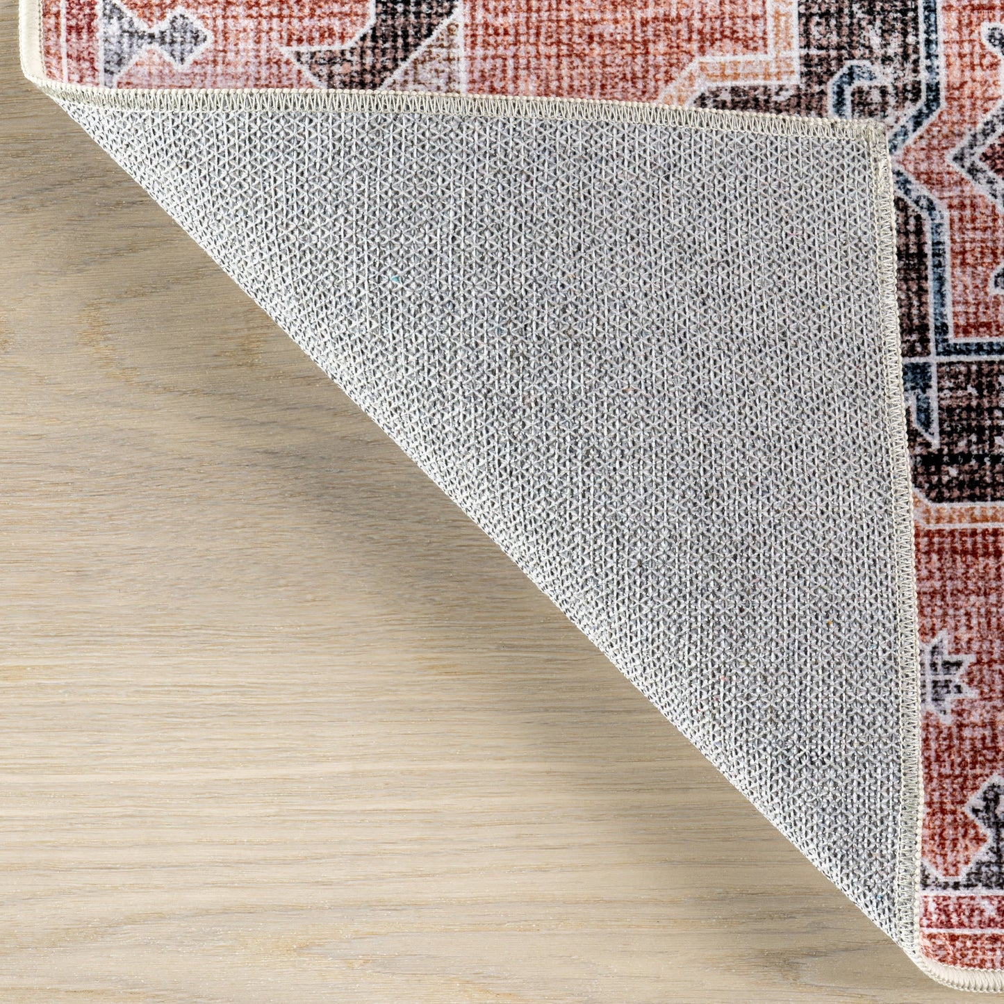 Brenda Hazy Heraldry Spill-Resistant Washable Rug in Pink