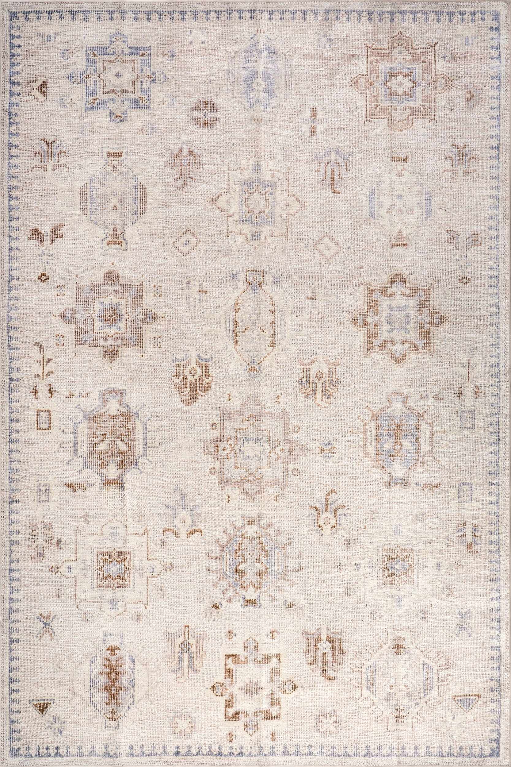 Isolated view of Beige Round Brenda Hazy Heraldry Spill Proof Washable Rug, showcasing its design
